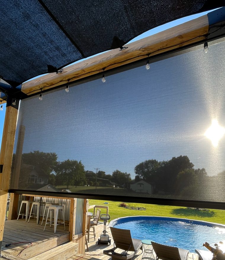 an outdoor pool deck with solar mesh screens
